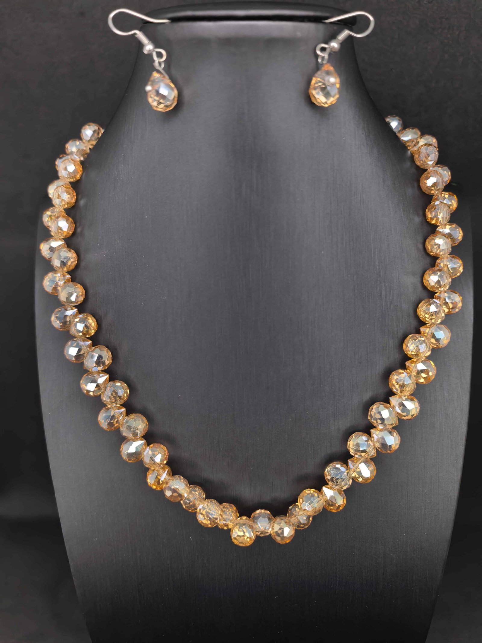 Peach-colored faceted glass bead mala and earring set-পার্টি, বিয়ে ও উৎসবে স্টাইল ও elegance বাড়ানোর জন্য।