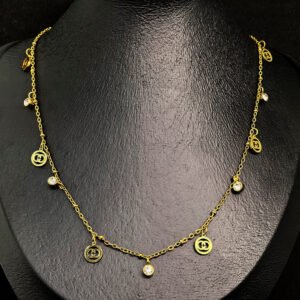 Gold plated stainless steel with gold circle and crystal stone