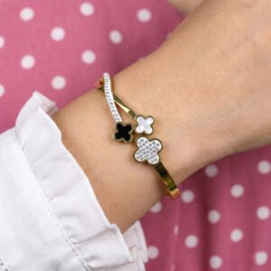 gold plated stainless steel bracelet with black and floral design