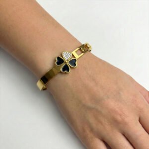 gold toned bracelet with black floral design for women