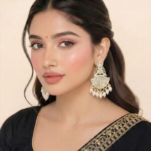 Kundan earrings with floral design and pearl drops for women.