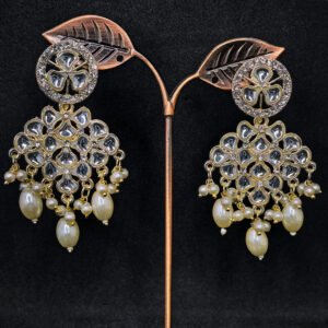 Kundan earrings with white stone and pearl drops for women.