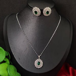 Silver toned necklace set for women featuring elegant green stone accents and a polished silver finish.