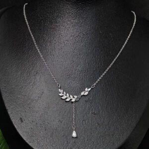 A beautiful silver-toned necklace featuring a leaf or wheat-shaped pendant embellished with sparkling stones for women.