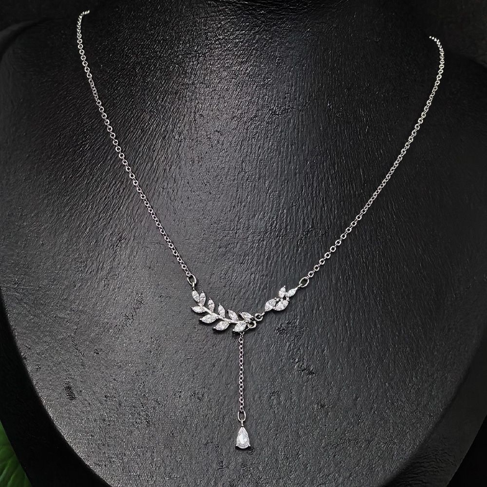 Silver-toned necklace featuring a leaf or wheat-shaped pendant embellished with sparkling stones – মহিলাদের জন্য ঝিলমিল পাথরে মোড়ানো স্টাইলিশ ফ্যাশন নেকলেস