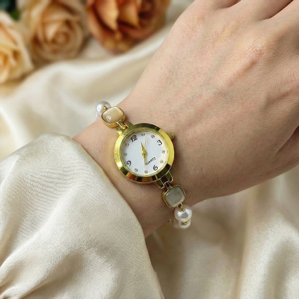 Women’s gold toned quartz bracelet floral design with white pearl – মহিলাদের জন্য রাজকীয় ব্রেসলেট ঘড়ি ও আভিজাত্যপূর্ণ ফ্যাশন ওয়াচ