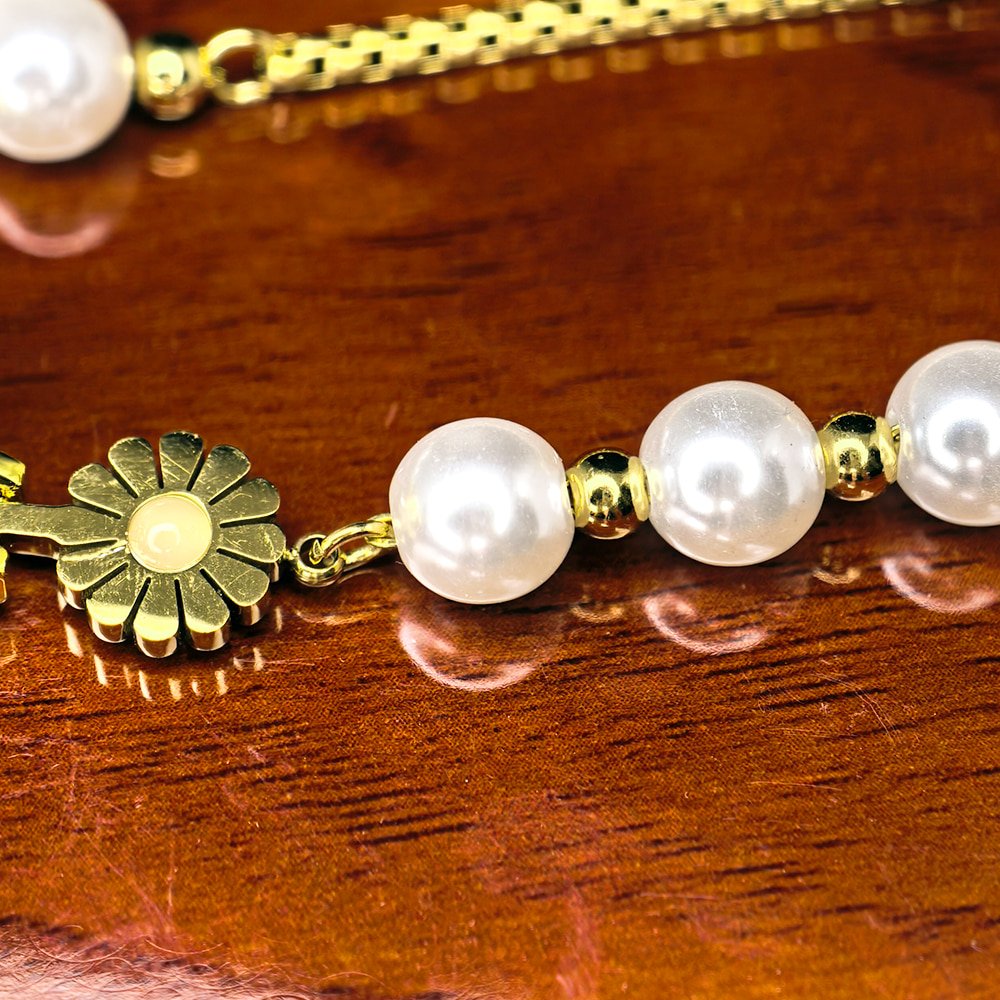 Women's gold toned quartz bracelet floral design with pearl – মহিলাদের জন্য রাজকীয় ব্রেসলেট ঘড়ি ও ফ্লোরাল ওয়াচ কালেকশন - Image 4