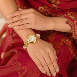 Gold toned floral quartz bracelet with white pearl.