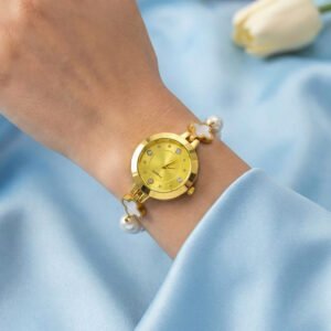 Elegant gold-toned quartz bracelet for women featuring an intricate flower design and a delicate pearl embellishment.