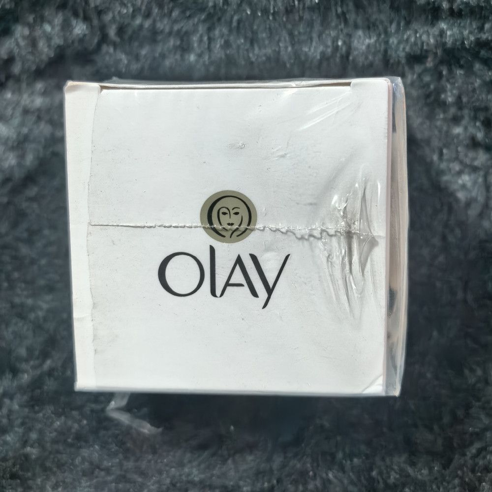 Olay White Paper Cream Box with Black and Gold Text Packaging